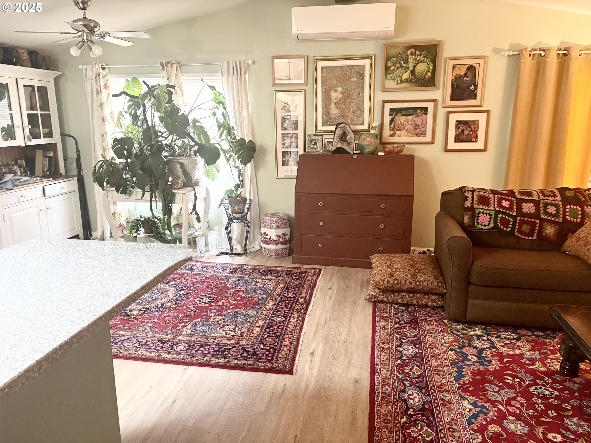 1699 North Terry Street, Unit 272 Eugene, OR 97402 - Photo 15 of 25 a living room with furniture and a rug