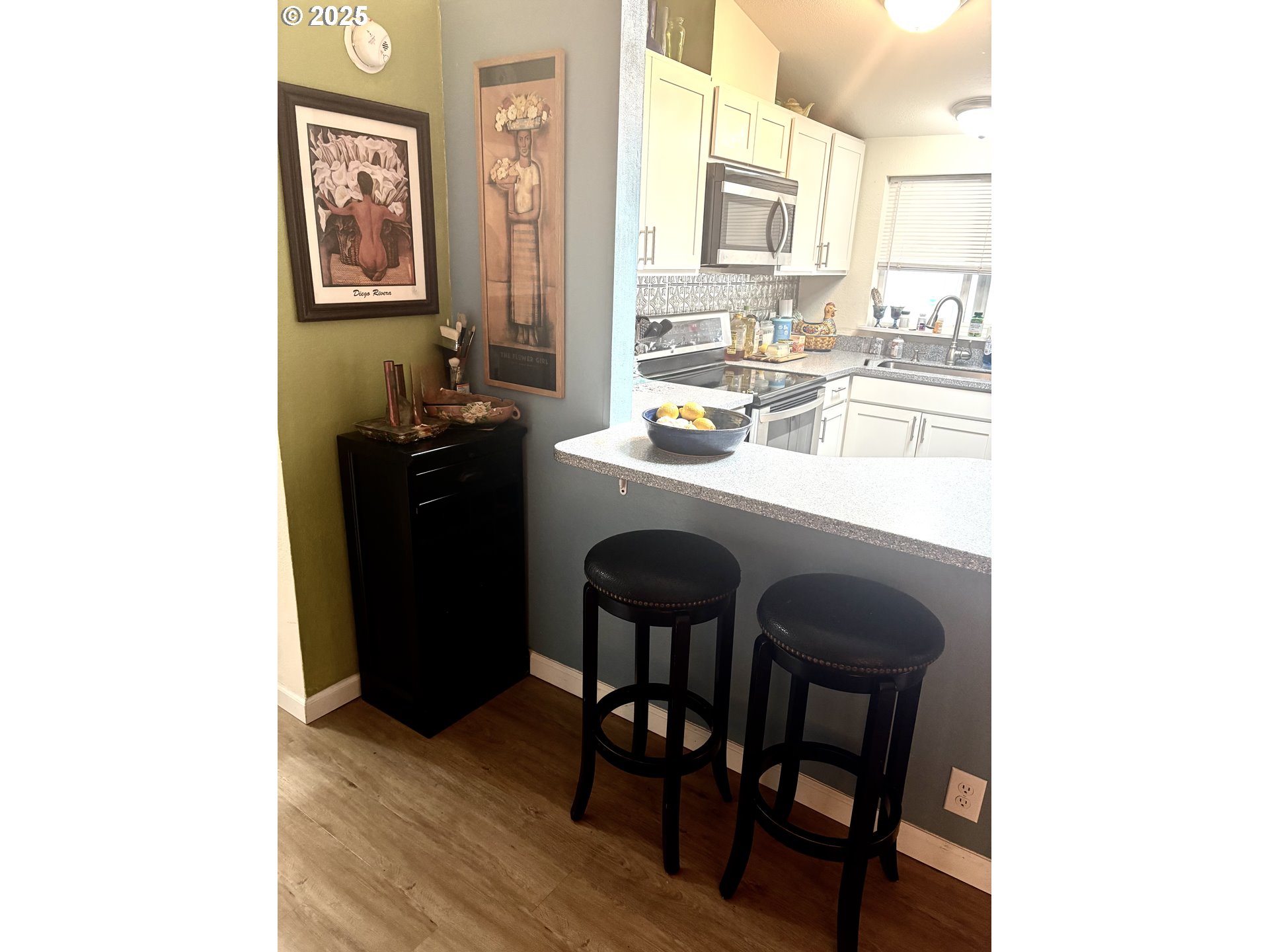 1699 North Terry Street, Unit 272 Eugene, OR 97402 - Photo 6 of 25 a kitchen with a sink cabinets and dining table