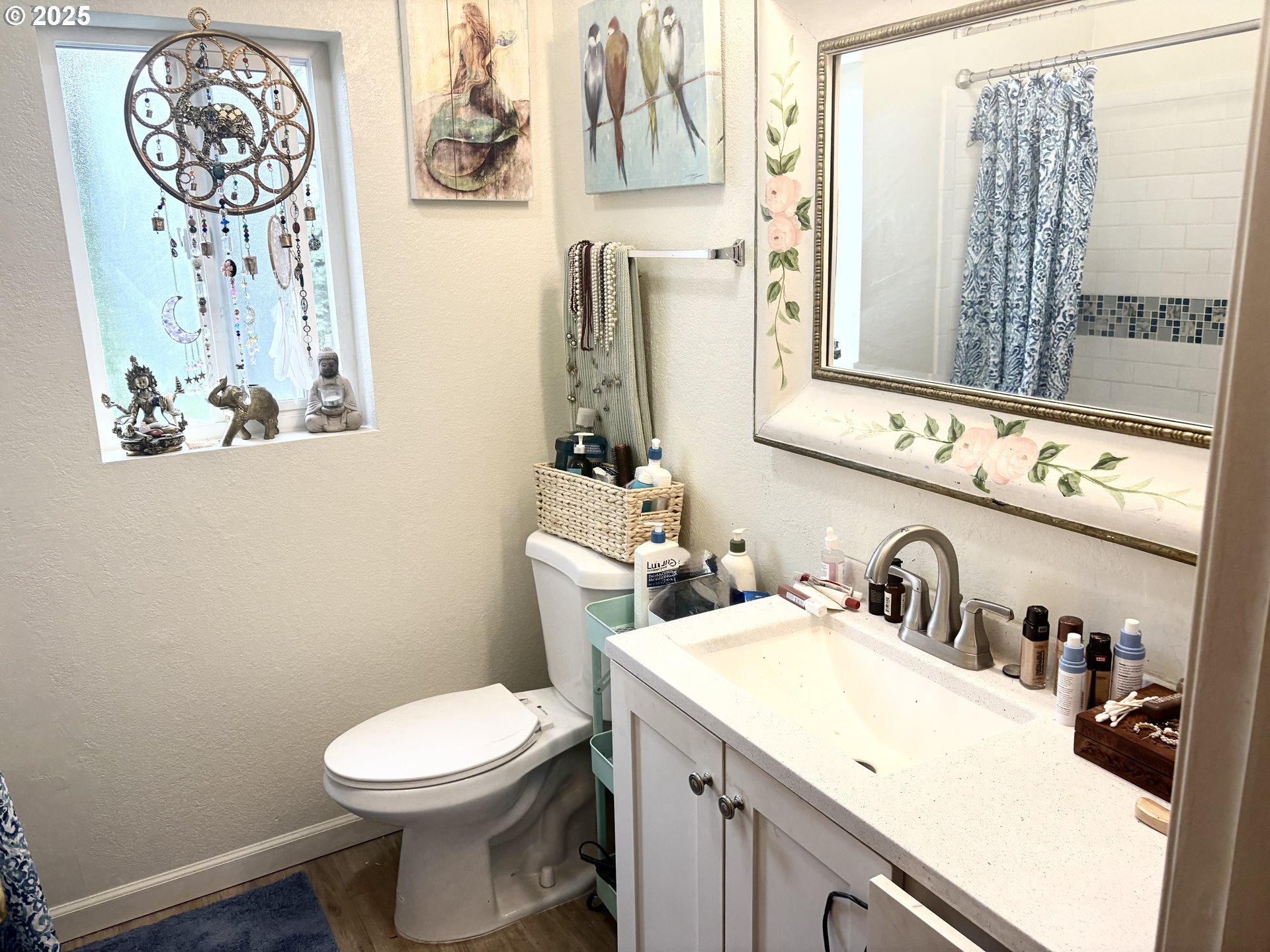 1699 North Terry Street, Unit 272 Eugene, OR 97402 - Photo 8 of 25 a bathroom with a toilet sink and mirror