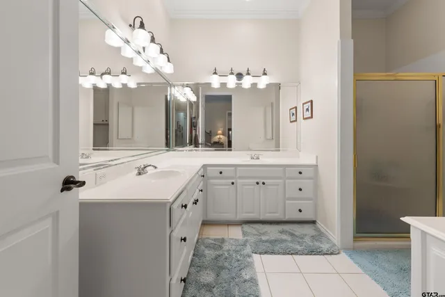 a bathroom with a sink vanity and mirror