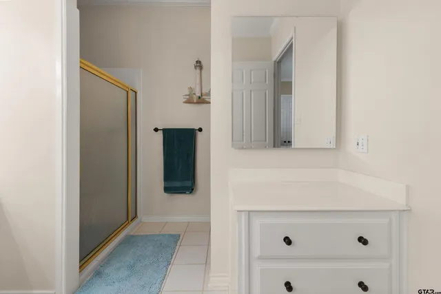 a bathroom with a sink and mirror