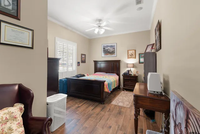 a bedroom with a bed and a desk