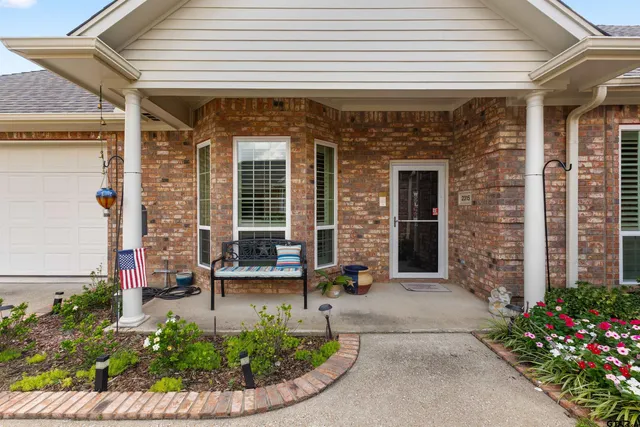 a front view of a house with a porch