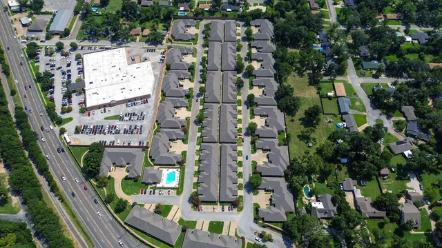 an aerial view of residential houses with outdoor space