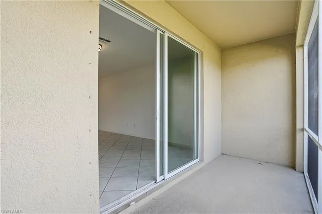 a view of a brick house with a yard