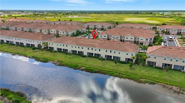 an aerial view of a house with outdoor space pool seating area and outdoor seating