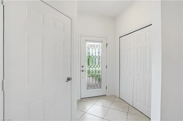 a view of an entryway with wooden floor