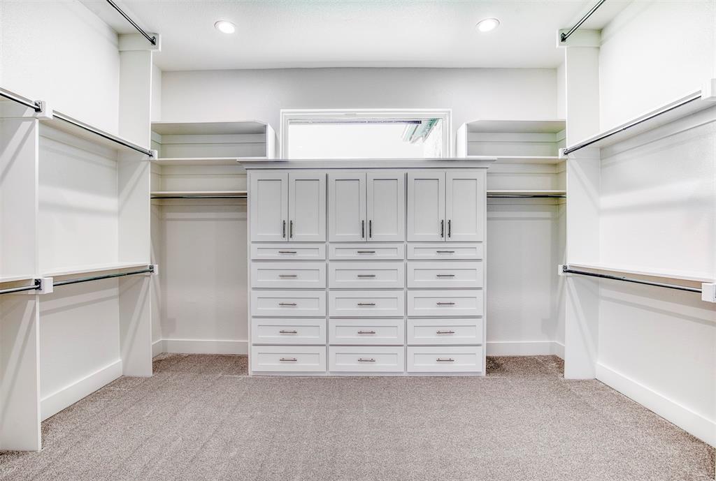 1044 Hidden Oaks Drive Wills Point, TX 75169 - Photo 17 of 29 a view of an empty walk in closet with empty racks