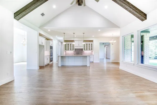 a view of kitchen with furniture and wooden floor