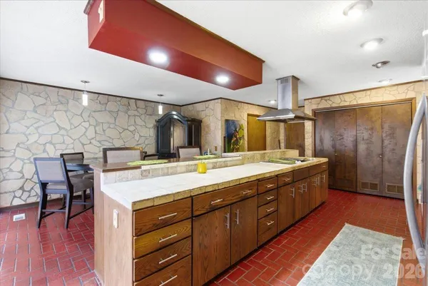 a spacious bathroom with a double vanity sink and a large mirror