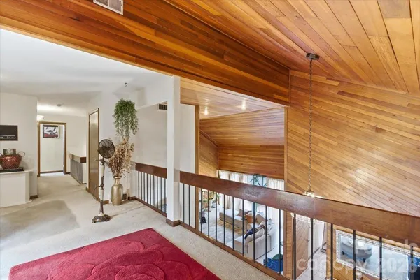 a view of a gallery with wooden floor