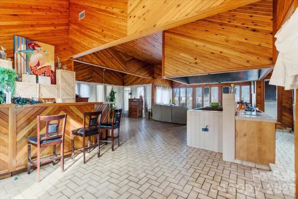 a view of a patio with a table and chairs