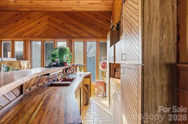 a view of balcony with furniture and wooden floor