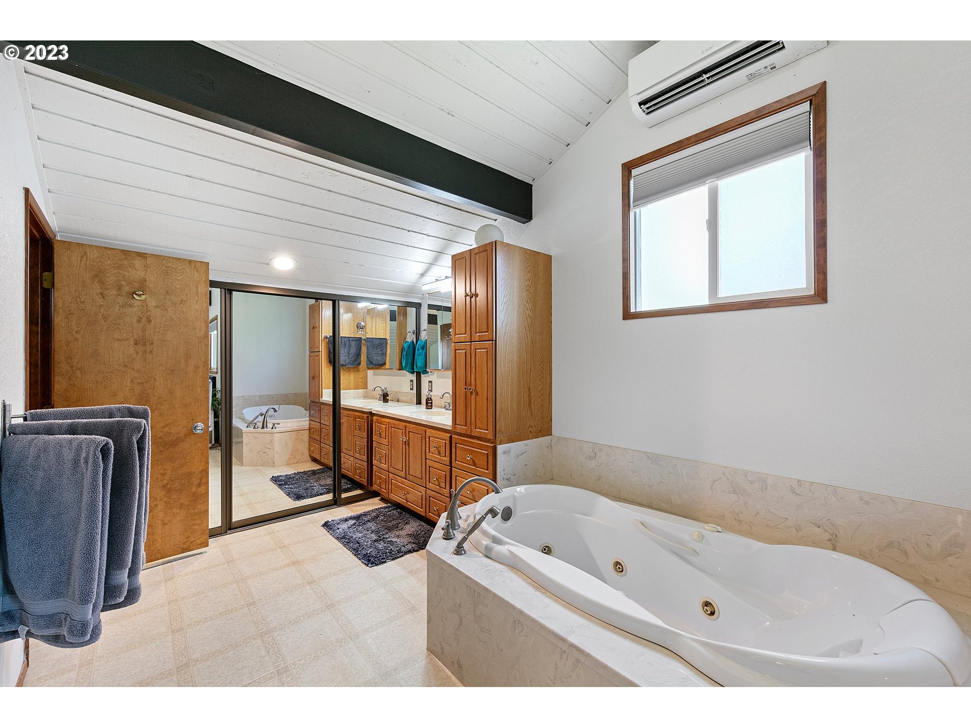 2117 7th Street Springfield, OR 97477 - Photo 25 of 48 a bathroom with a tub sink toilet and mirror