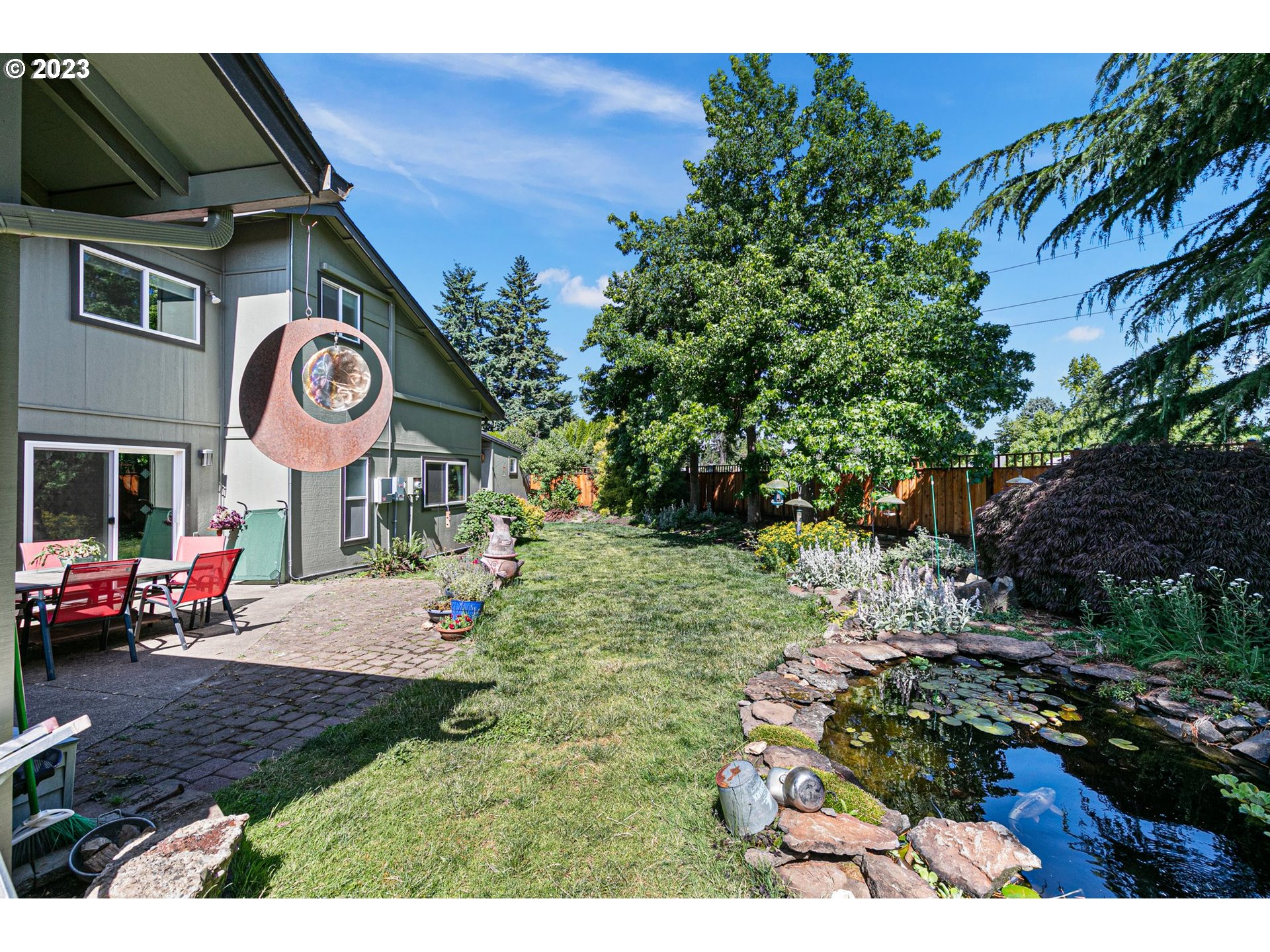 2117 7th Street Springfield, OR 97477 - Photo 38 of 48 a view of a park with bench and potted plants
