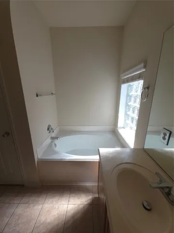 a utility room with cabinets washer and dryer
