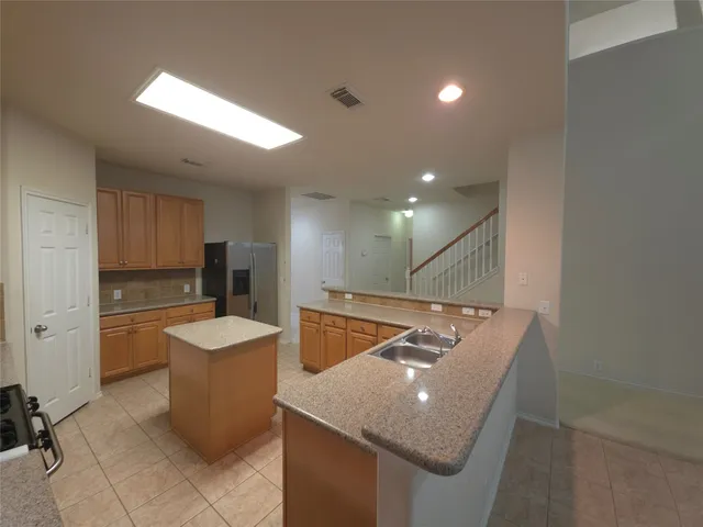 a view of empty room with a fireplace