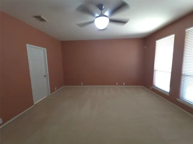a view of a storage and utility room with empty racks