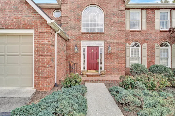 a view of a a dining room with furniture window and wooden floor