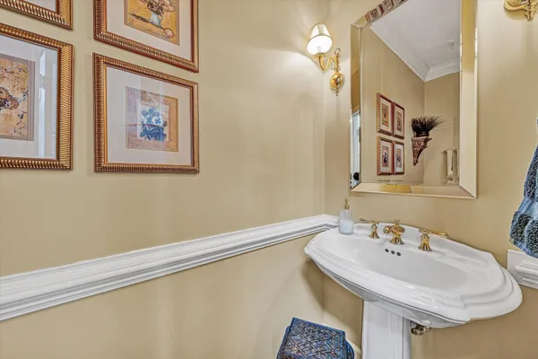 a living room with furniture a fireplace a rug and a large window