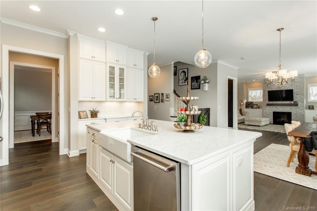 5231 Meadowcroft Way Fort Mill, SC 29708 - Photo 12 of 40 a kitchen that has a lot of cabinets and wooden floor