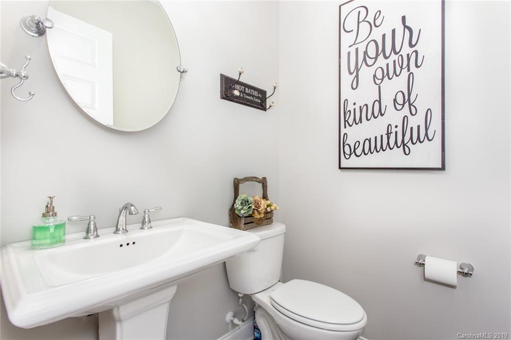 5231 Meadowcroft Way Fort Mill, SC 29708 - Photo 15 of 40 a bathroom with a toilet a sink and mirror