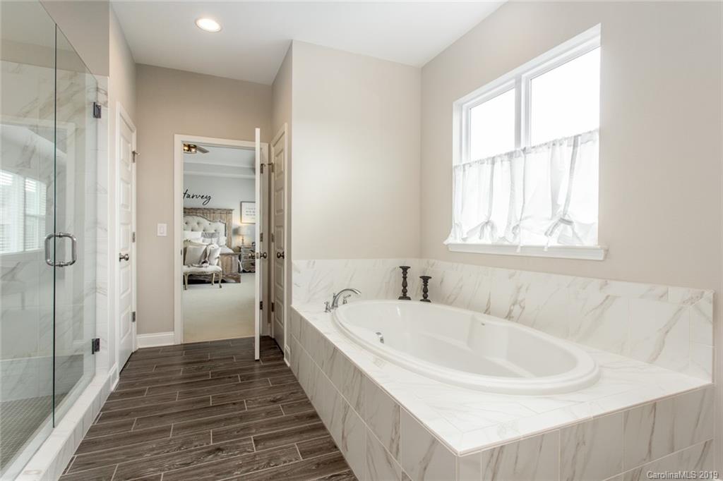 5231 Meadowcroft Way Fort Mill, SC 29708 - Photo 20 of 40 a bathroom with a bathtub and a sink
