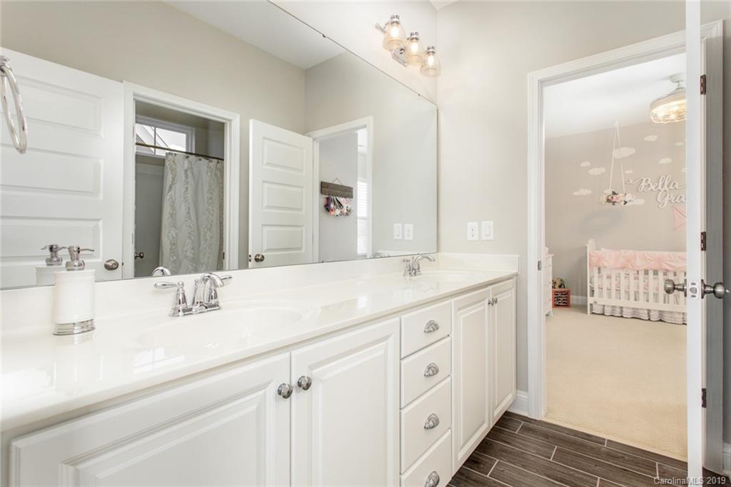 5231 Meadowcroft Way Fort Mill, SC 29708 - Photo 26 of 40 a bathroom with a double vanity sink and mirror