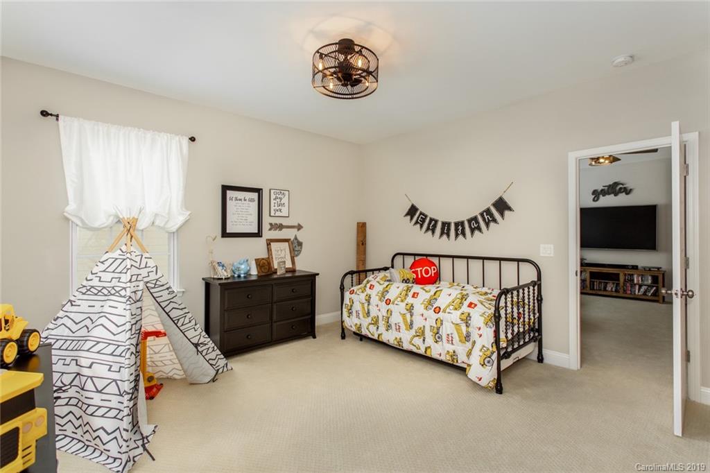 5231 Meadowcroft Way Fort Mill, SC 29708 - Photo 29 of 40 a bedroom with furniture and a bathtub