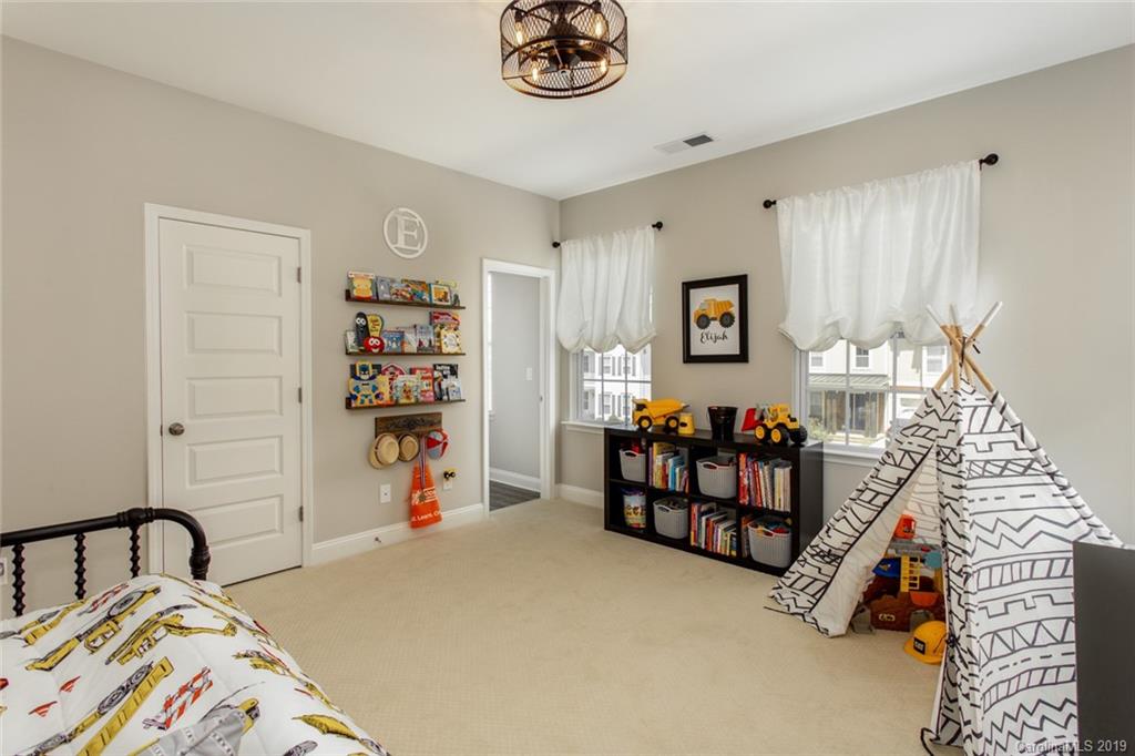 5231 Meadowcroft Way Fort Mill, SC 29708 - Photo 30 of 40 a bedroom with baby bed and a window