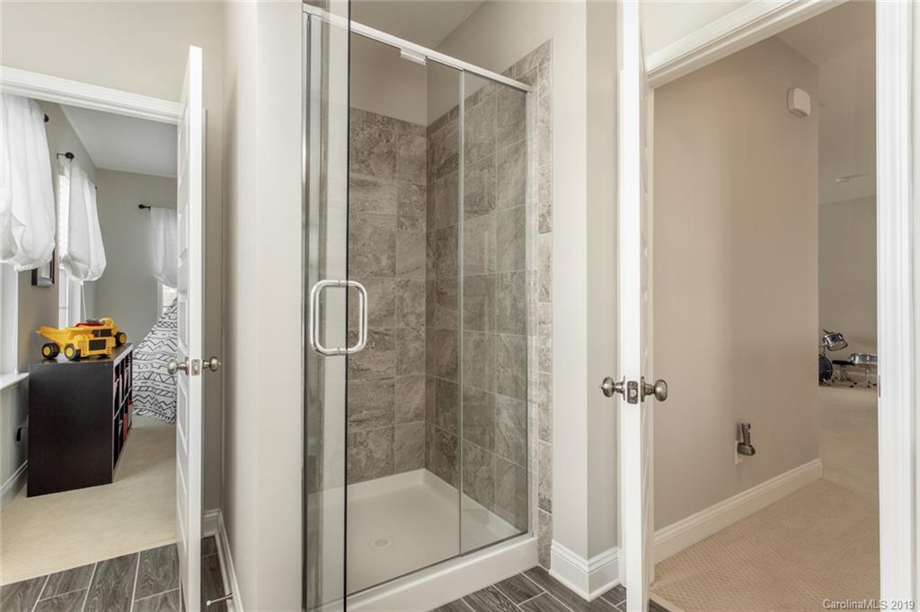 5231 Meadowcroft Way Fort Mill, SC 29708 - Photo 31 of 40 a bathroom with a shower and a tub