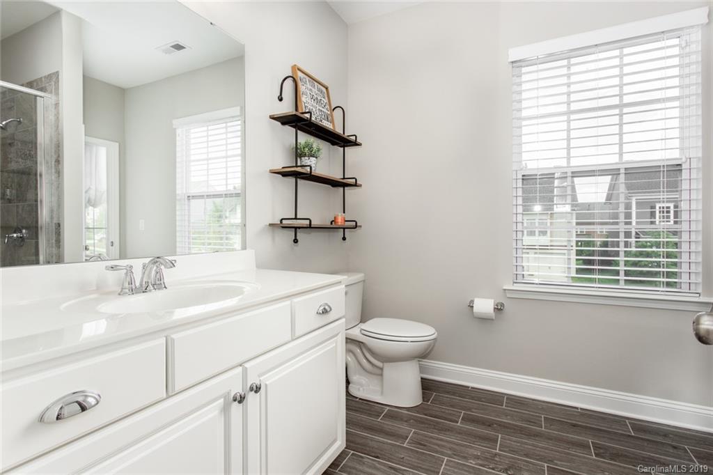 5231 Meadowcroft Way Fort Mill, SC 29708 - Photo 32 of 40 a spacious bathroom with a toilet sink and window