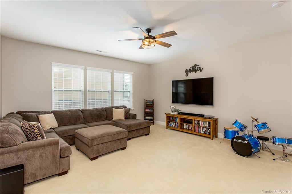 5231 Meadowcroft Way Fort Mill, SC 29708 - Photo 33 of 40 a living room with furniture and a flat screen tv