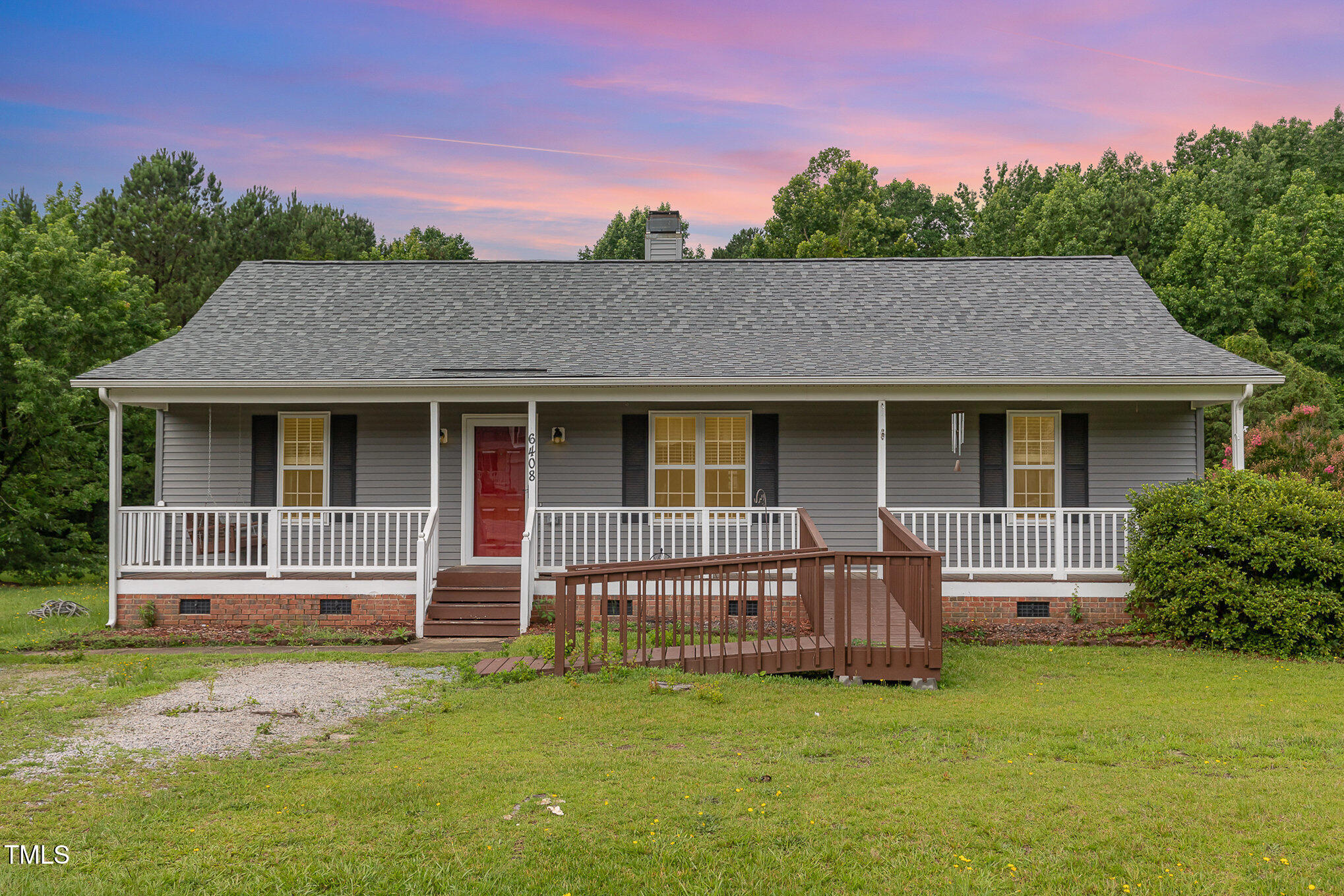 6408 Glen Brack Court Raleigh, NC 27603 - Photo 1 of 23 a view of a house with a yard and sitting area