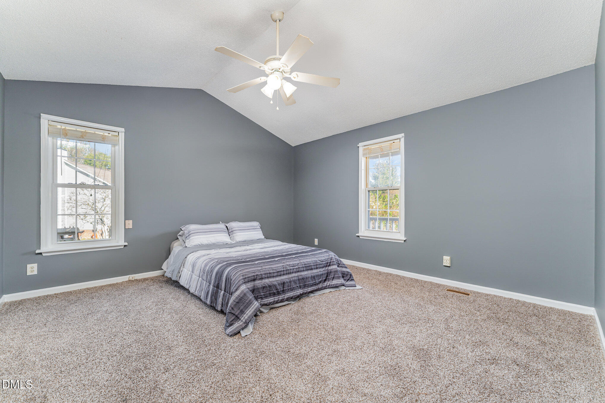 6408 Glen Brack Court Raleigh, NC 27603 - Photo 10 of 23 a spacious bedroom with a bed and a window