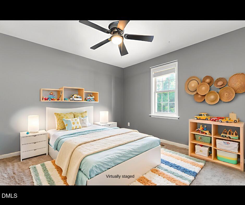 6408 Glen Brack Court Raleigh, NC 27603 - Photo 3 of 23 a bedroom with a bed and a chandelier