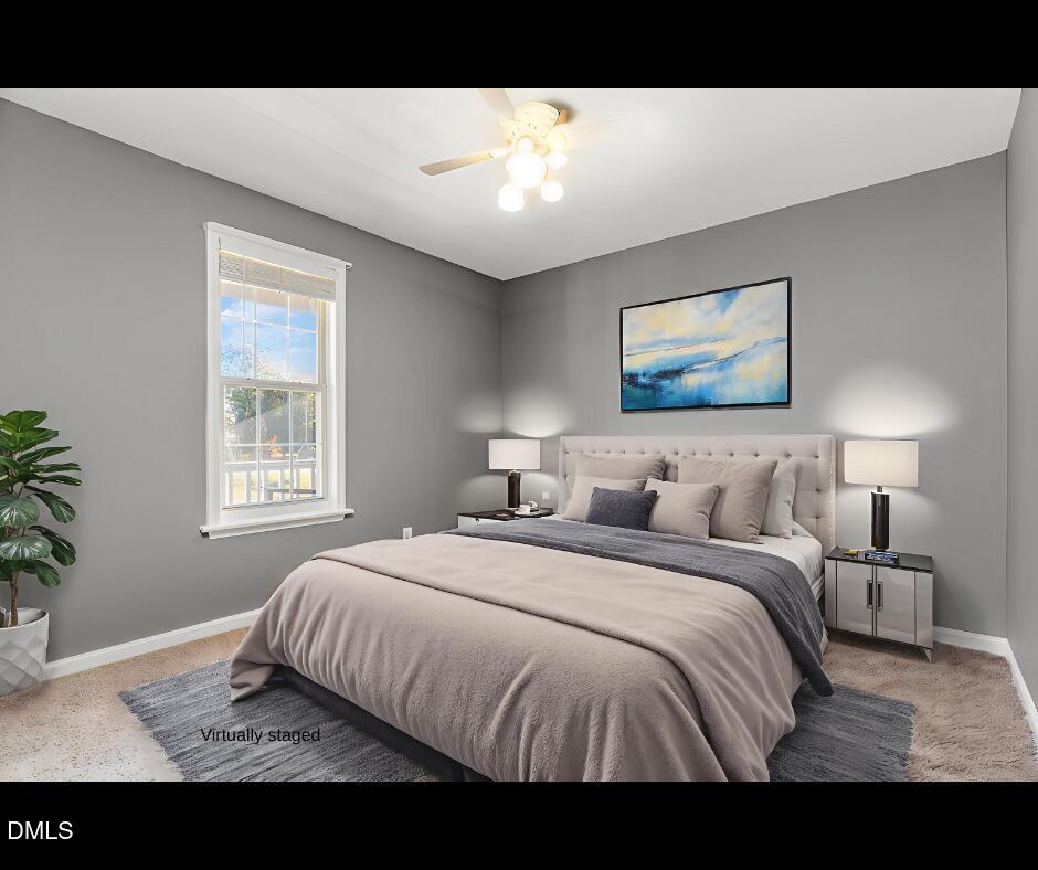6408 Glen Brack Court Raleigh, NC 27603 - Photo 4 of 23 a bedroom with a bed and a painting on the wall