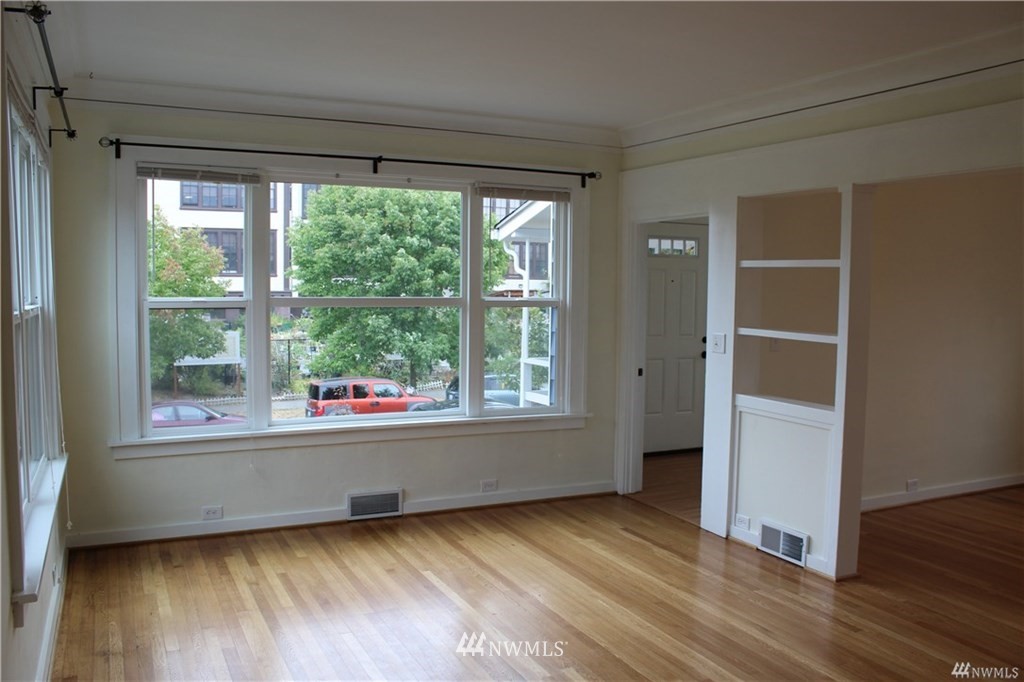2515 16th Avenue South Seattle, WA 98144 - Photo 2 of 18 a view of empty room with wooden floor and fan