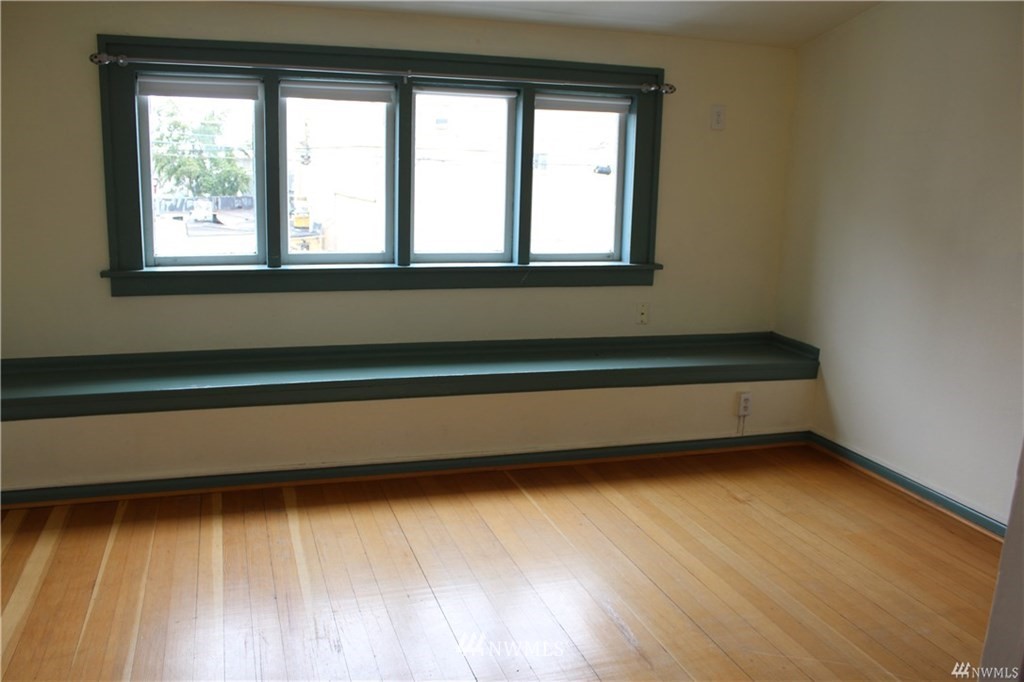2515 16th Avenue South Seattle, WA 98144 - Photo 13 of 18 a view of a room with wooden floor and windows