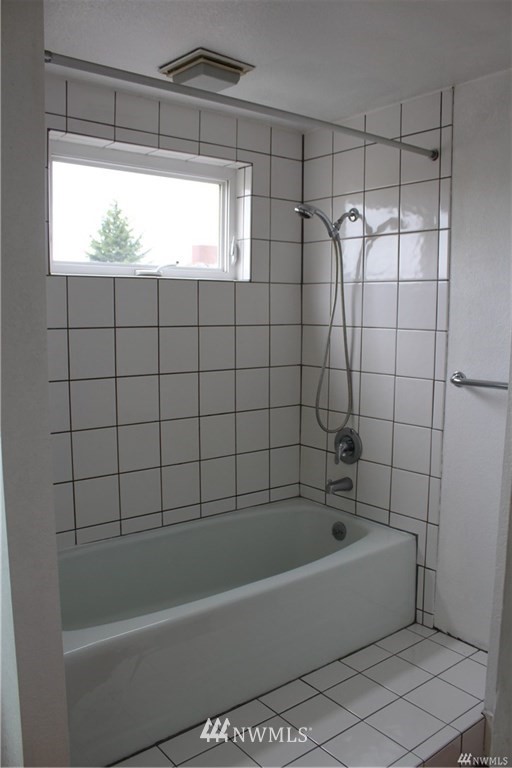 2515 16th Avenue South Seattle, WA 98144 - Photo 14 of 18 a bathroom with a bathtub and window