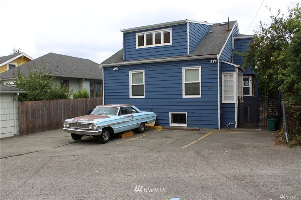 2515 16th Avenue South Seattle, WA 98144 - Photo 16 of 18 a car parked in front of a house