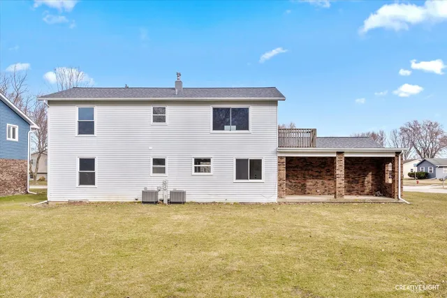 a front view of a house with large windows