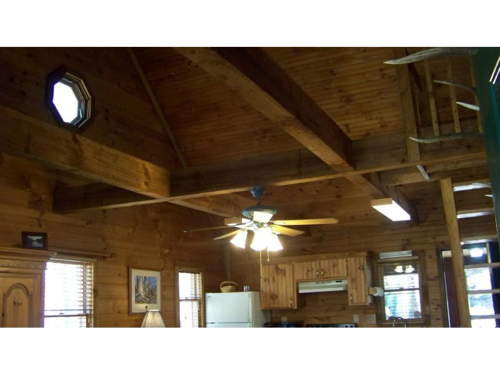6070 Sink Valley Road Butler, TN 37640 - Photo 4 of 34 VAULTED CEILING WOOD BEAMS