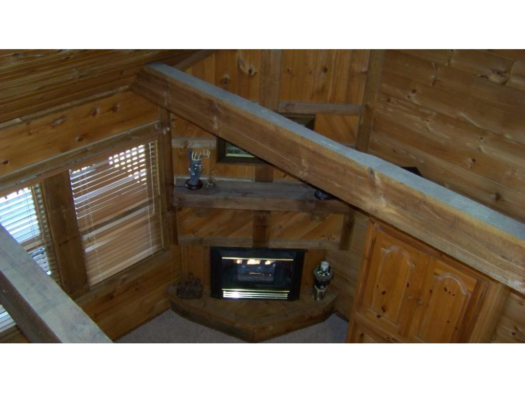 6070 Sink Valley Road Butler, TN 37640 - Photo 8 of 34 GAS LOG FIREPLACE TO CEILING