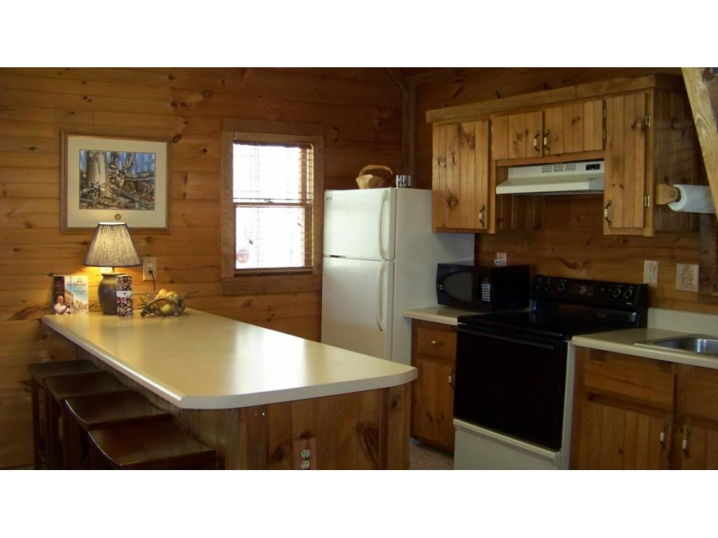 6070 Sink Valley Road Butler, TN 37640 - Photo 9 of 34 ISLANDBAR IN KITCHEN