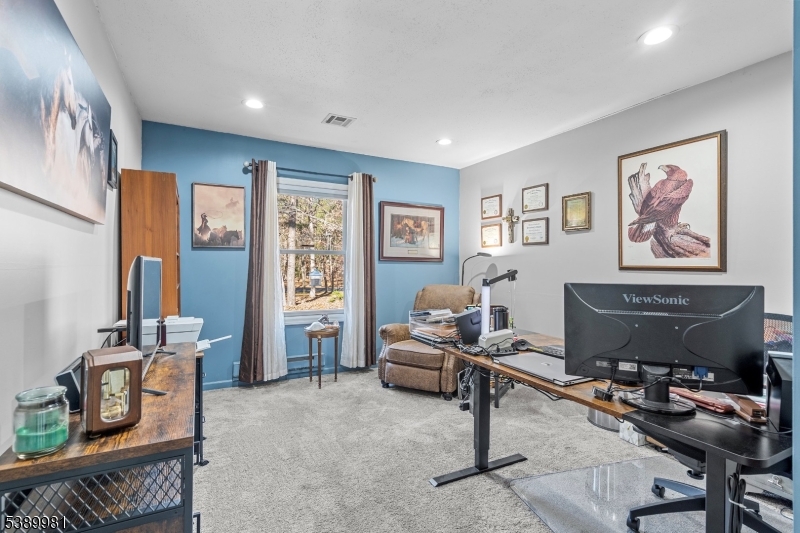 379 East Bird Village Road Jackson, NJ 08527 - Photo 16 of 38 a living room with furniture a window and a flat screen tv
