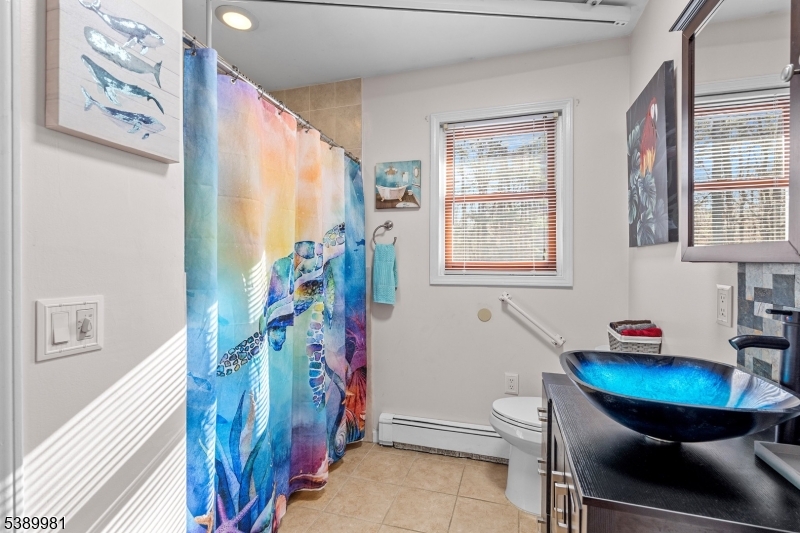 379 East Bird Village Road Jackson, NJ 08527 - Photo 17 of 38 a room with furniture and a potted plant