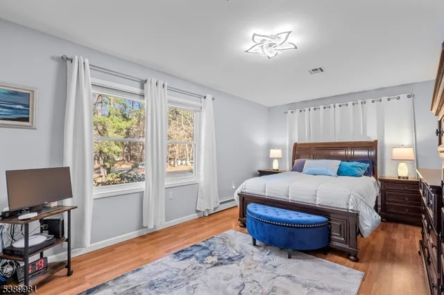 a bed room with furniture and a window