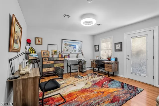 a view of a workspace with furniture and workspace