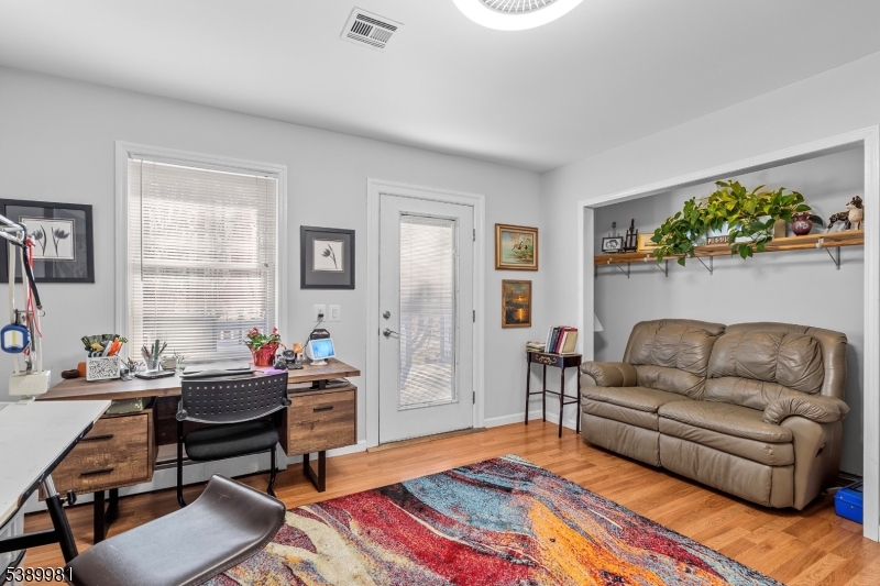 379 East Bird Village Road Jackson, NJ 08527 - Photo 24 of 38 a living room with furniture and a large window
